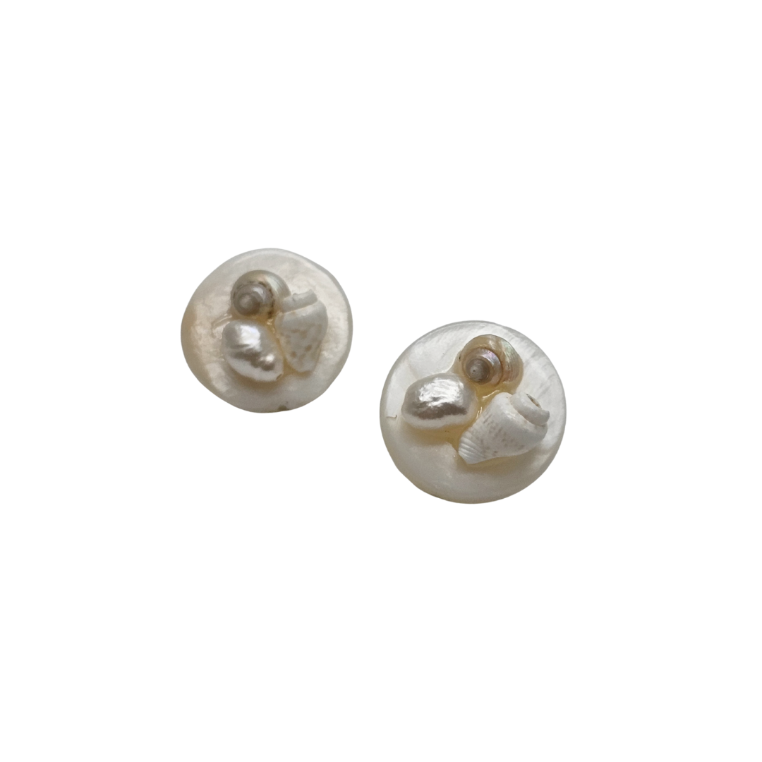 Pair of pearl earrings on a white background