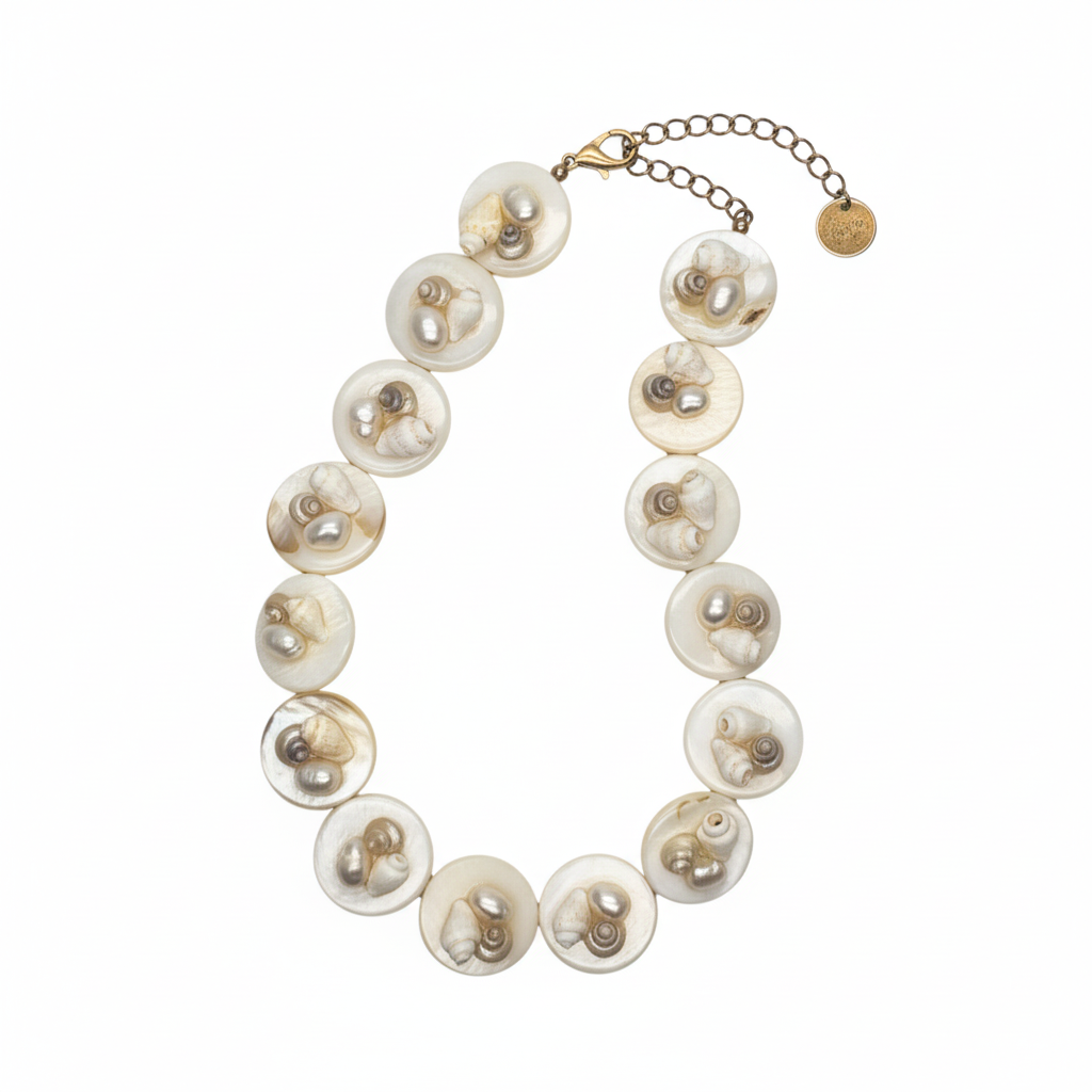 Pearl necklace with gold chain on a white background