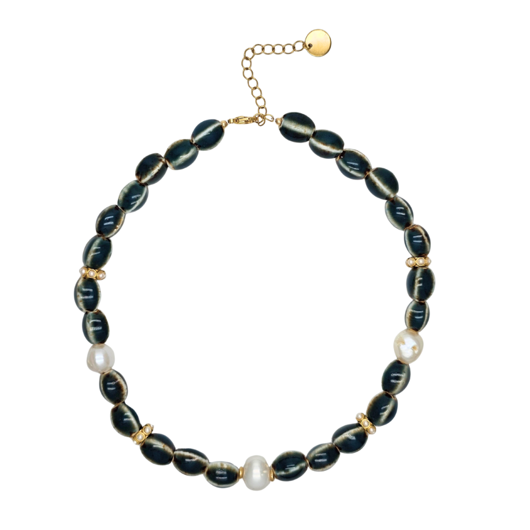 Necklace with black beads and pearls on a white background