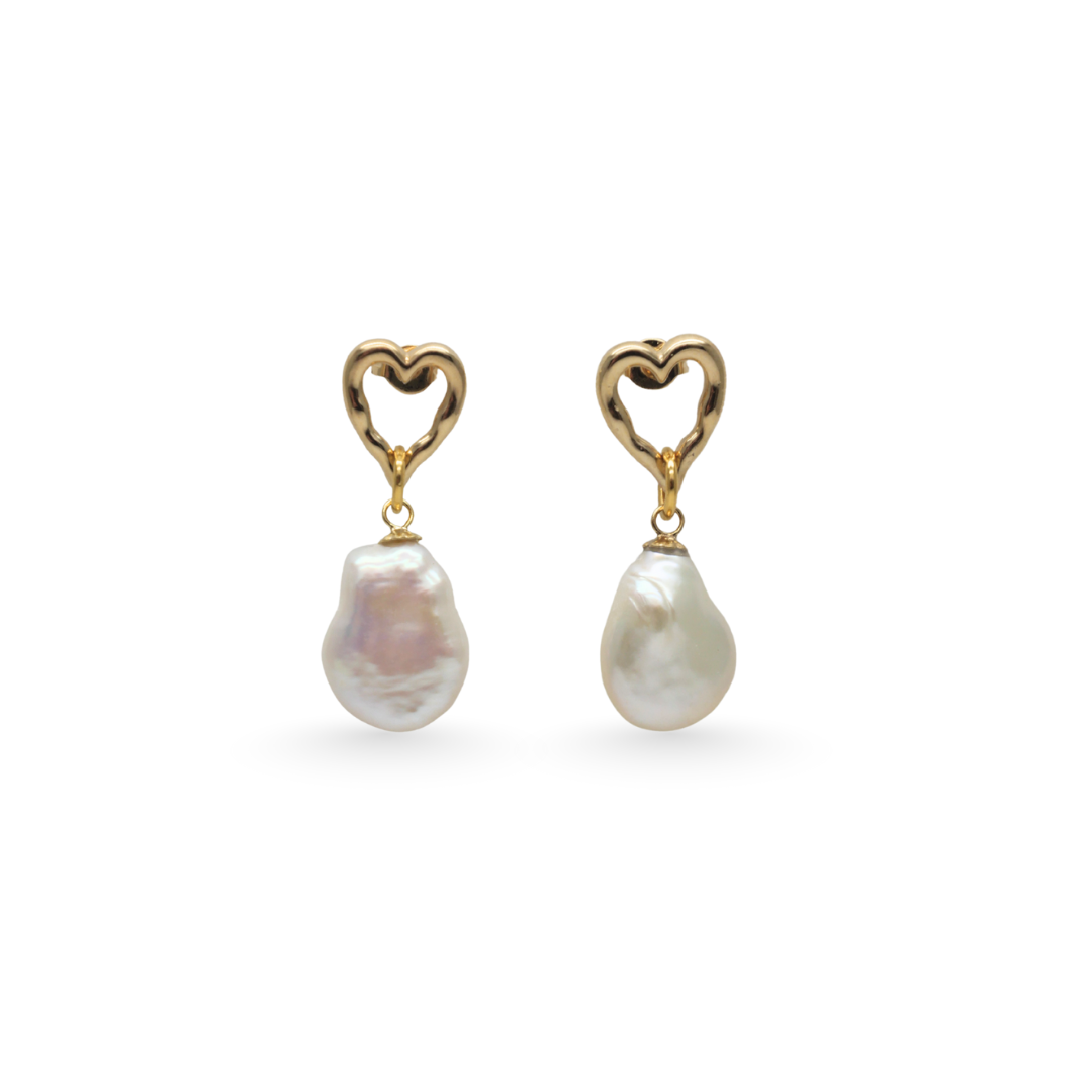 Pair of pearl earrings with heart-shaped gold hooks on a white background