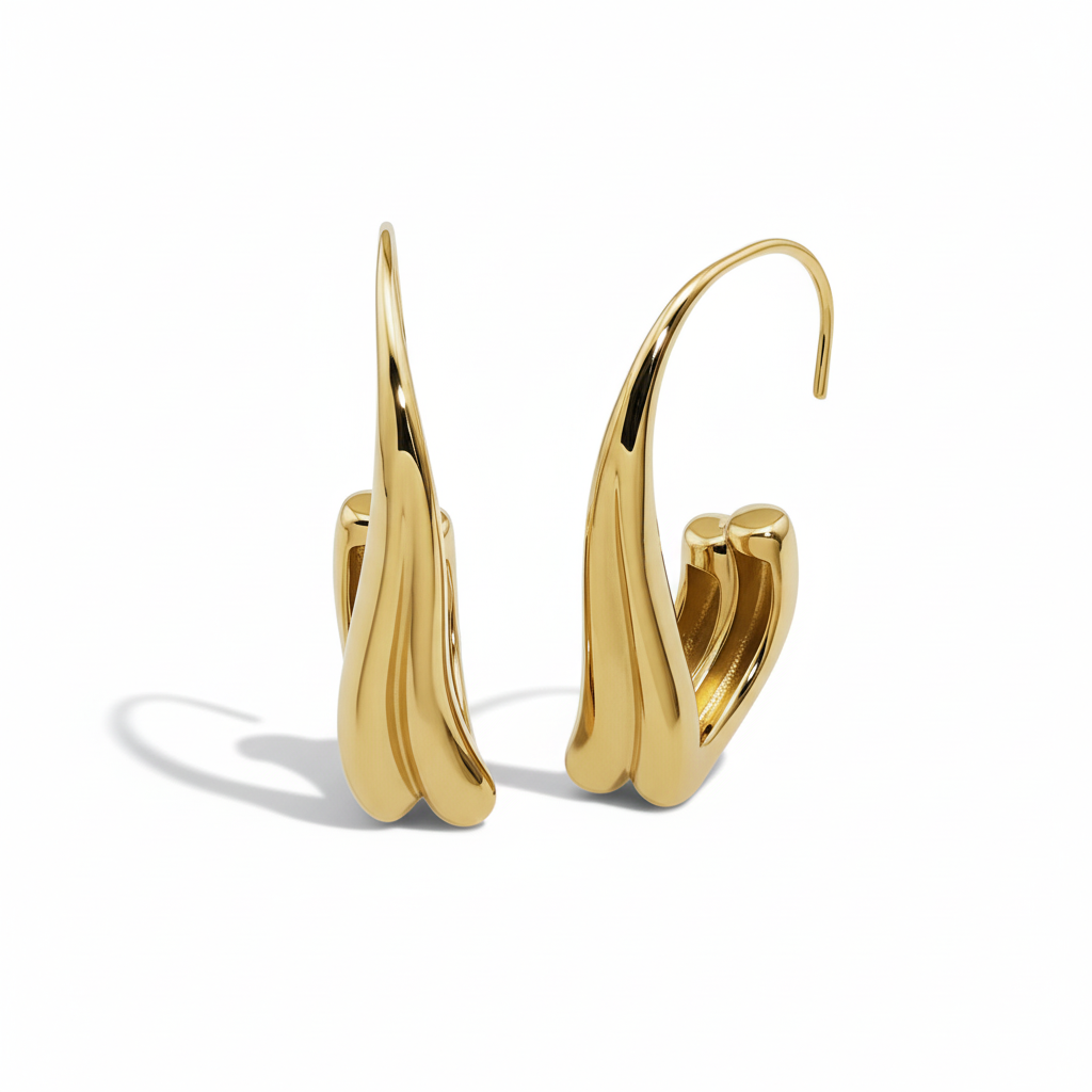 Pair of gold earrings on a white background