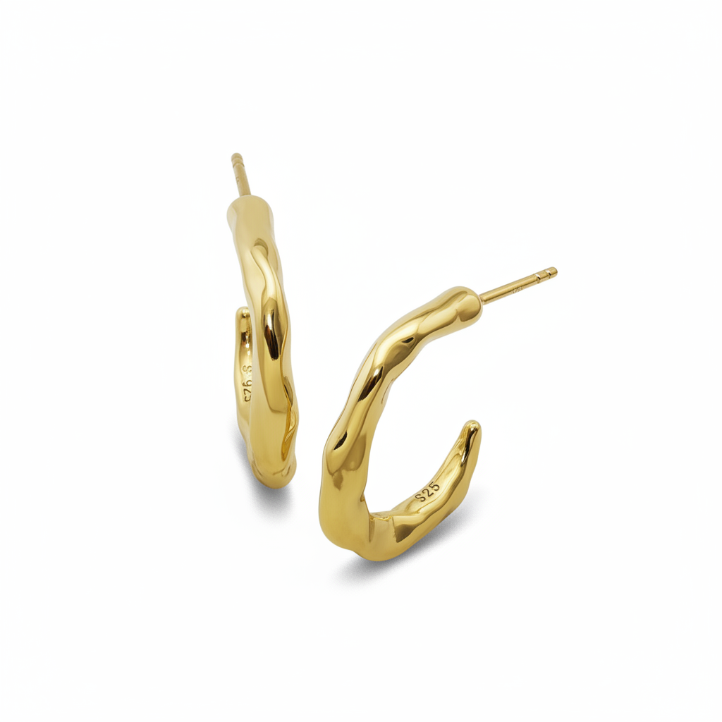 Gold hoop earrings on a white background