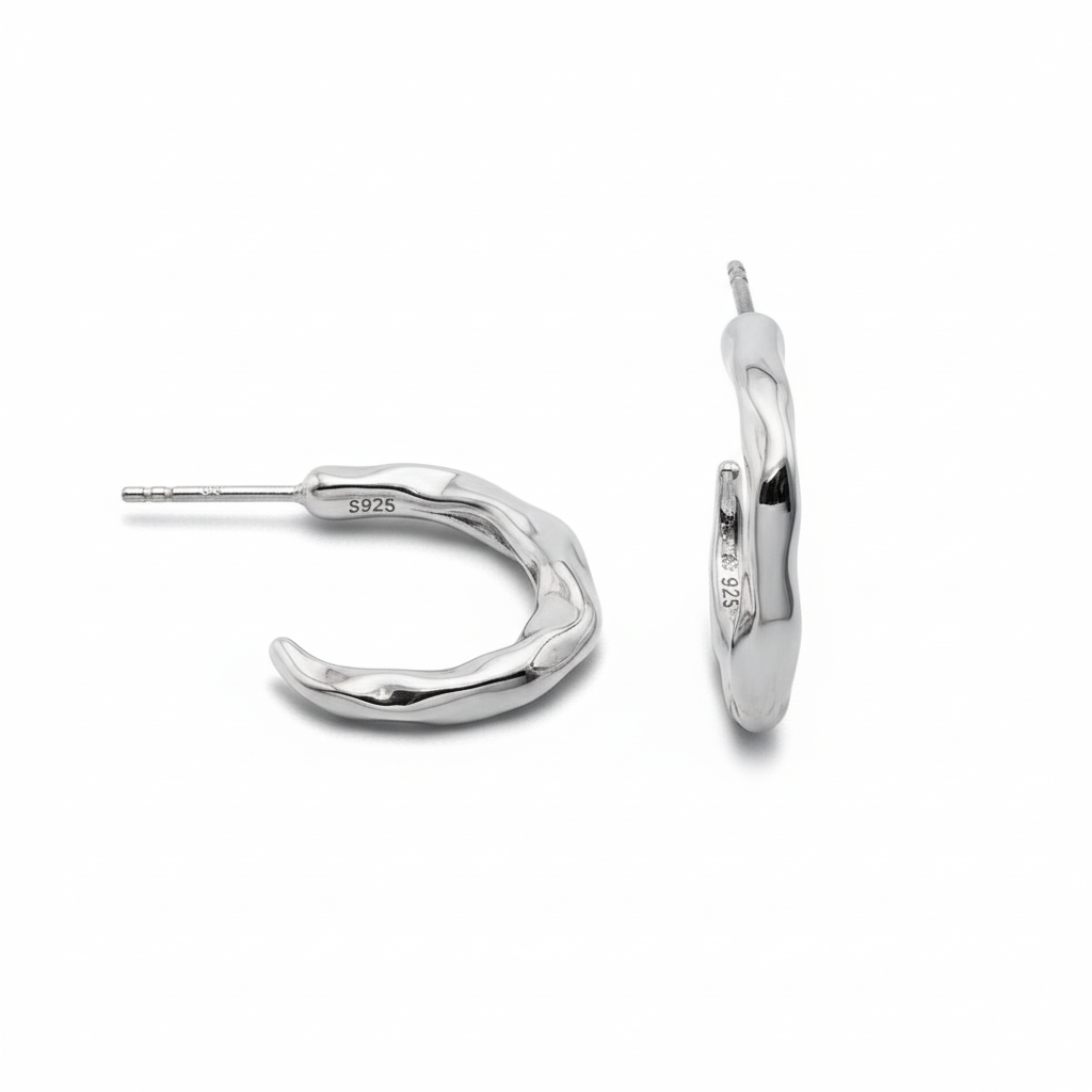 Silver hoop earrings on a white background