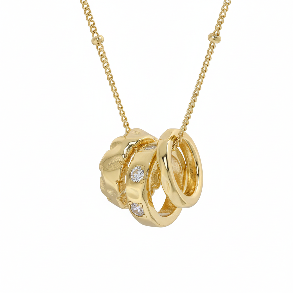 Gold necklace with interlocking rings and embedded diamonds on a white background