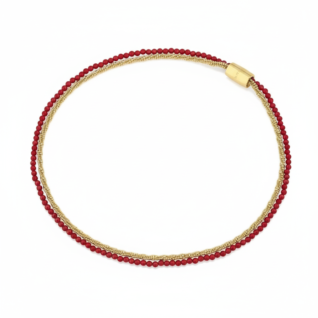 Necklace with red beads and gold chain on a white background