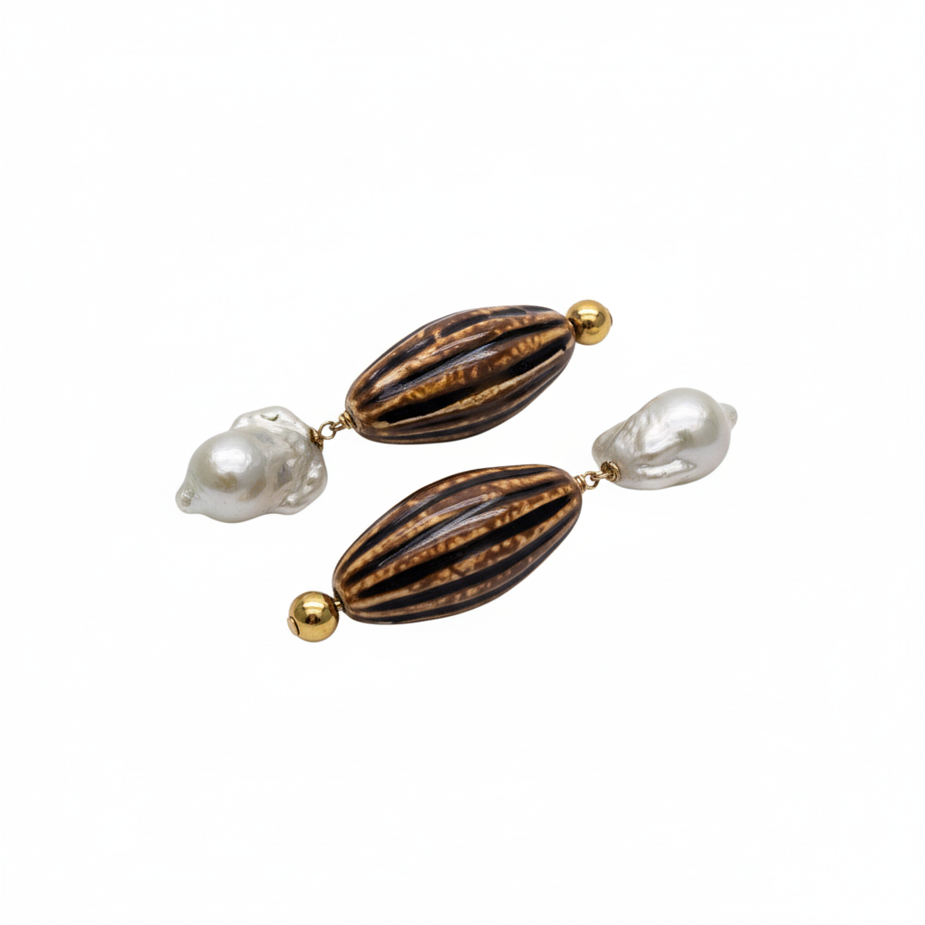 Pair of earrings with brown striped beads and white pearls on a white background