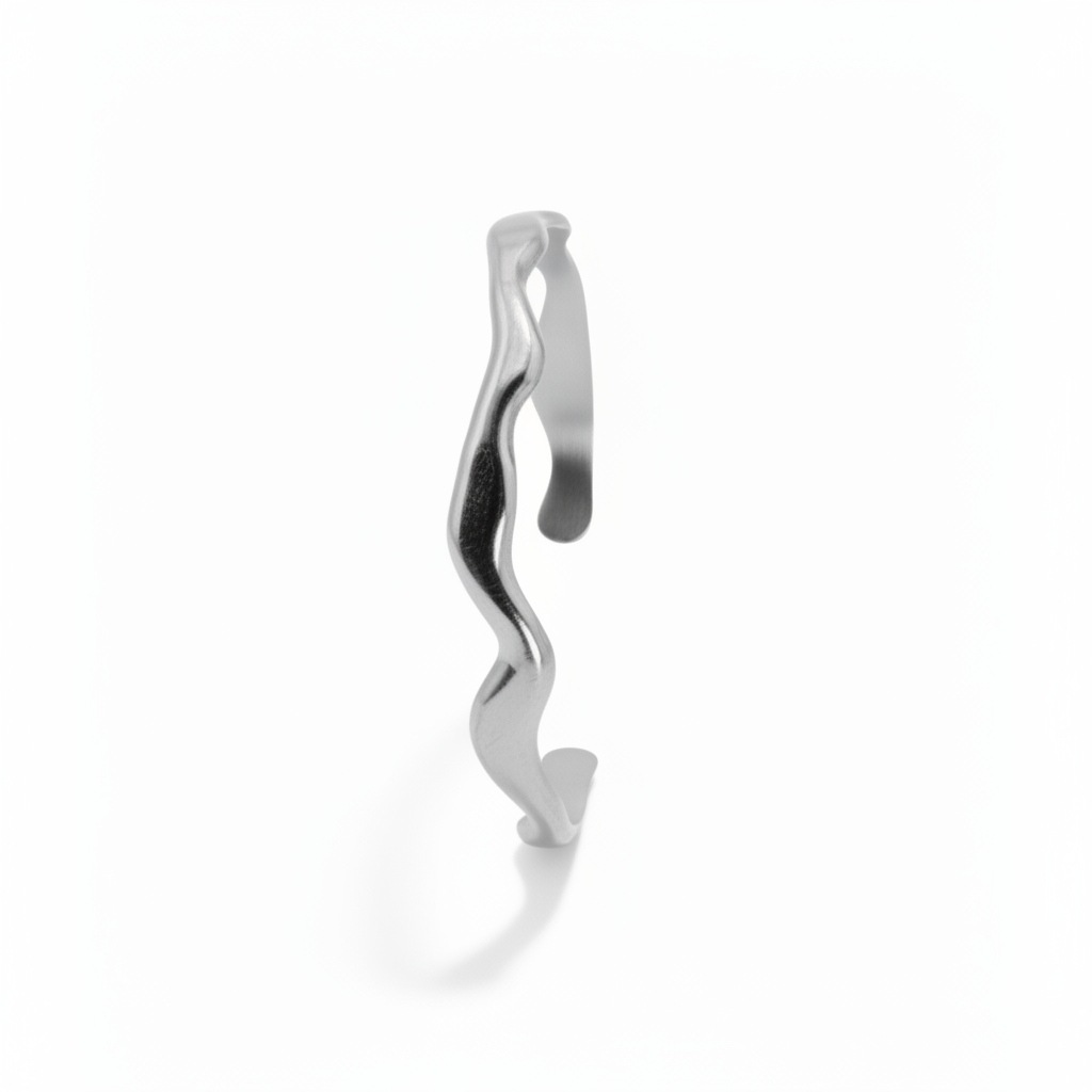 Silver bracelet with wavy design on a white background