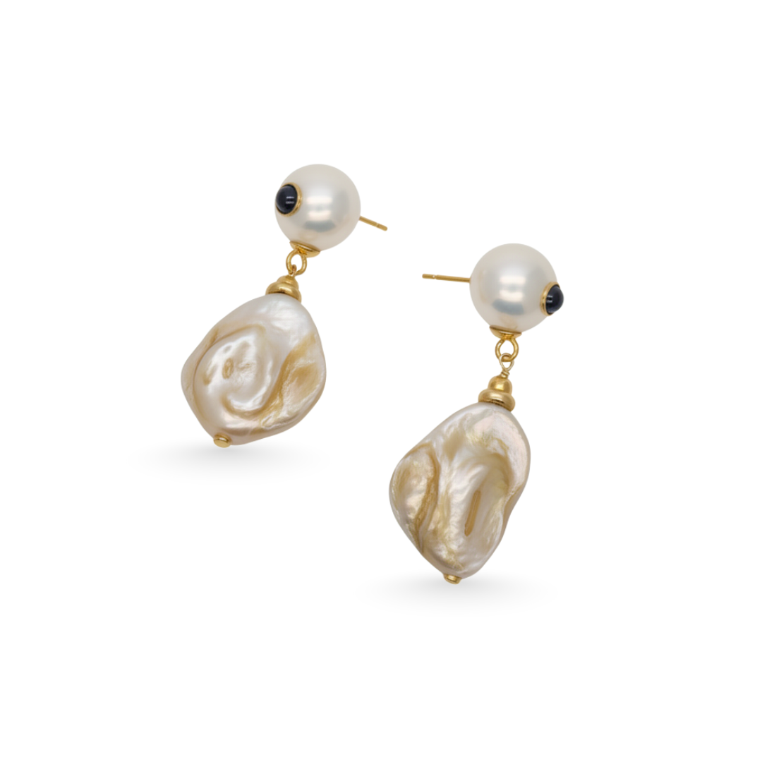 Pair of pearl earrings with gold accents on a white background