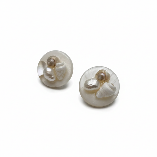 Pair of pearl earrings on a white background