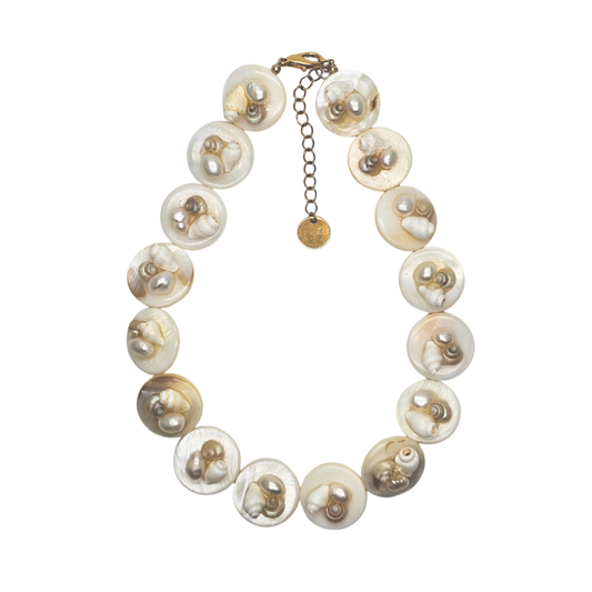 Pearl necklace with gold accents on a white background