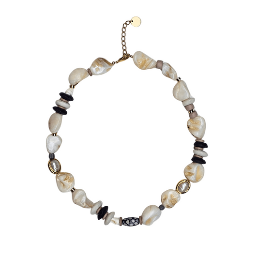 Necklace with shell beads on a white background