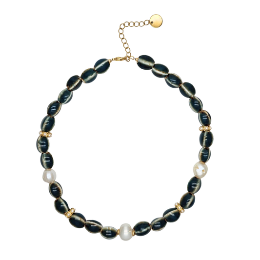 Necklace with black beads and pearls on a white background