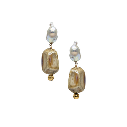 Pair of earrings with gold and pearl-like beads on a white background