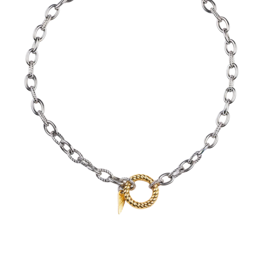 Silver chain necklace with a gold charm on a white background