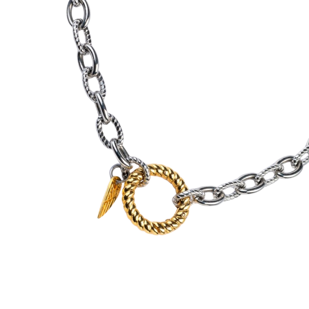 Gold and silver chain necklace with a unique clasp on a white background
