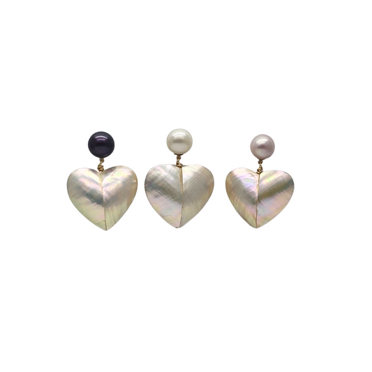 Heart-shaped earrings with pearl and black bead accents on a white background