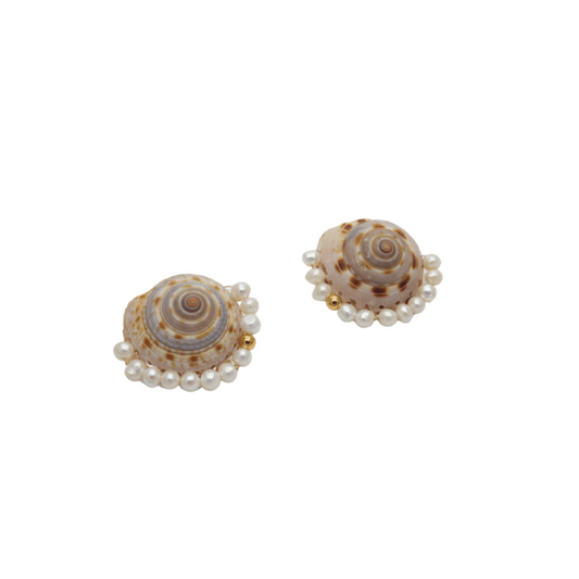 Pair of shell-shaped earrings with pearl accents on a white background