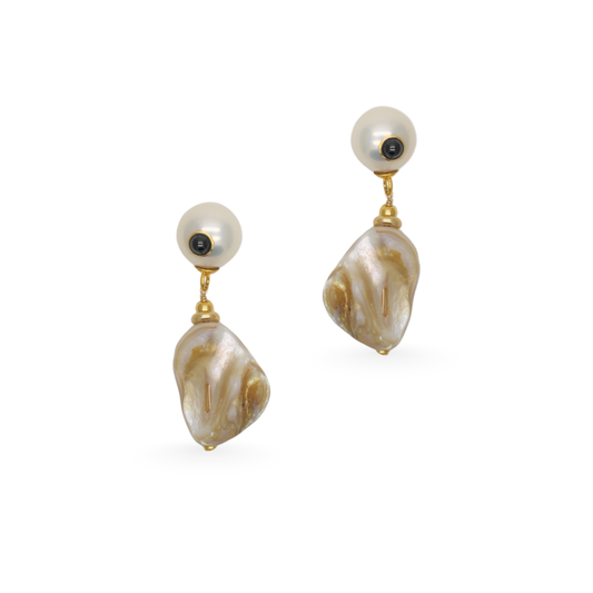 Pair of pearl earrings with gold accents on a white background