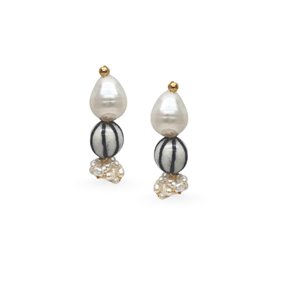 Pair of earrings with pearls and striped beads on a white background
