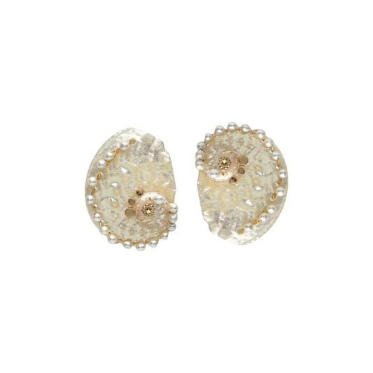 Pair of gold and clear crystal earrings on a white background